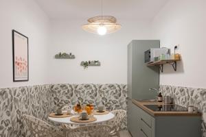 a kitchen with a table with drinks on it at Dimore Margherita in Petacciato