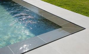 a pool of water with grass next to it at Romantic Hotel & Restaurant Villa Cheta Elite in Maratea