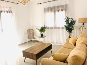 a living room with a couch and a coffee table at Aeria Elegant Luxury Villa in Asprovalta +43 photos