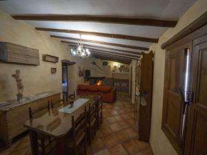 a living room with a table and a couch at 4-Guest Laroya Cottage with Pool in Laroya