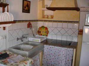 a kitchen with a sink and a counter top at 4-Guest Laroya Cottage with Pool in Laroya +16 photos