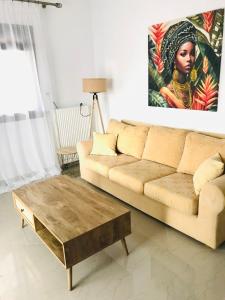 a living room with a couch and a coffee table at Aeria Elegant Luxury Villa in Asprovalta