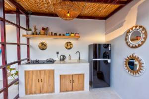 a kitchen with a sink and a counter at Villa Calipso in Gili Trawangan