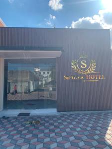 a building with a sign on the side of it at Semar Hotel in Tjakranegara +6 photos