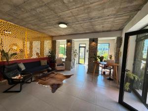a living room with a couch and a table at Hotel Lamish in Mestia