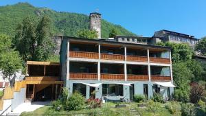 a building on the side of a mountain at Hotel Lamish in Mestia