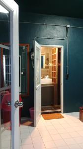 a bathroom with a shower and a toilet and a sink at HiSSS Style ชะอำ in Cha Am +53 photos