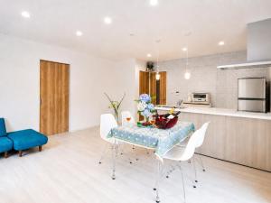 a kitchen and dining room with a table and chairs at Knot in Shodoshima +14 photos