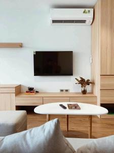 a living room with a tv and a coffee table at Ronaldo Palacios in Pagadian