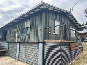 a house with a garage with a balcony at Comara Jindabyne Unit 1 in Jindabyne +1 photo