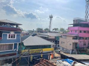 a group of houses and buildings in a city at Instahomestay in Vālpārai