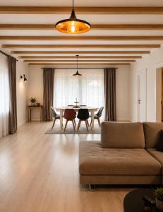 a living room with a couch and a table at Garden Retreat Keyhouse in Bran