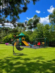 a playground with a slide in a park at Garden Retreat Keyhouse in Bran