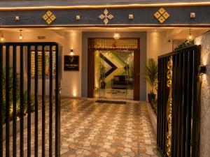 a front door of a house with a gate at Winter Valley Grand Araku in Araku