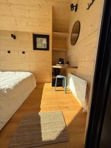 a small room with a bed and a desk at Camping Pier10 in Bourscheid