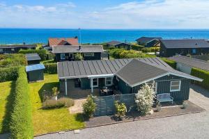 an aerial view of a house with the ocean at FY421-Frorup-Grantoften-3 in Frørup