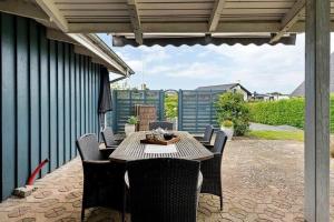 a patio with a table and chairs on a patio at FY421-Frorup-Grantoften-3 in Frørup +27 photos