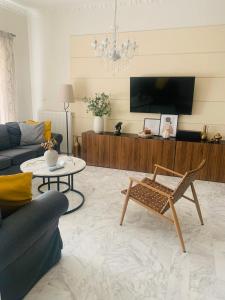 a living room with a couch and a table at Christos House in Afantou