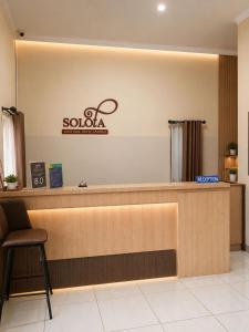 a lobby of a salon with a reception desk at Solota Boutique Hotel Syariah in Bonorejo
