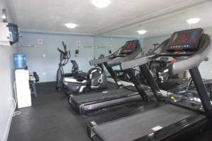 a gym with several cardio machines in a room at Quality Inn Piedras Negras in Piedras Negras