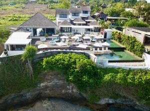 an aerial view of a resort with a pool at The Palms Ceningan Hotel in Nusa Lembongan