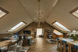 a living room with skylights and a ceiling with sk lighting at Stradom House Hotel & Spa, Autograph Collection in Krakow