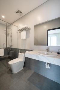 a bathroom with a toilet and a sink at Gao House in Hanoi +25 photos