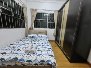 a bedroom with a bed and a window at Stay181 Bintulu in Bintulu