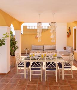 a dining room with a table and chairs at La Manga Amarilla in Cartagena
