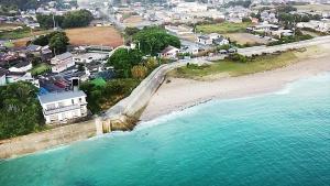 an aerial view of a beach next to the water at Ocean view JUN in Shima