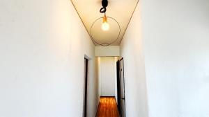 a hallway in an office building with a ceiling at Ocean view JUN in Shima