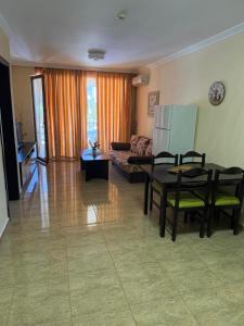 a living room with a couch and a table at Premium Apartments in Sveti Vlas