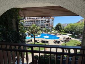a view from a balcony of a hotel with a swimming pool at Premium Apartments in Sveti Vlas