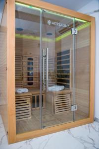 a glass display case in a room with wood at Private Riverside Villa Silvia in Mostar