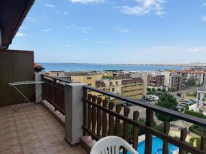 a balcony with a view of the ocean and buildings at Premium Apartments in Sveti Vlas
