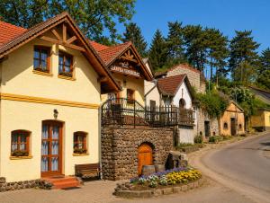 a large house with a building at Egri Leányka Vendégház in Eger