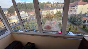 a view of a city from a window at Apartament Balto in Borsec