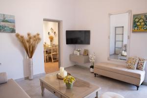 a living room with a couch and a table at Casa Maritina Gennadi Traditional House in Gennadi