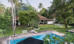 an aerial view of a house with a swimming pool at Echoing Dream Resort in Galle
