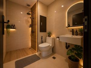 a bathroom with a toilet and a sink at ETERNITY FORMOSA 2BR BALCONY 76m2 in Jodoh