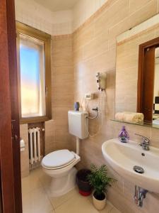 a bathroom with a toilet and a sink at Tra Terra e Laguna in Venice +63 photos