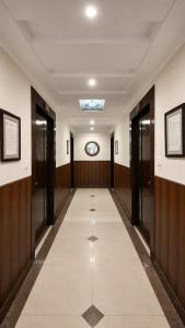 a hallway with doors and a walkway at Hotel Rio Haridwar in Haridwār