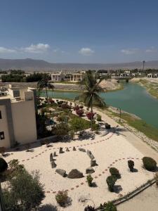 an aerial view of a resort with a river at Hawana Studio SL-3 in Wādī Khasbar