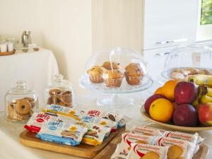 a counter top with a bunch of food and fruit at B&B Ca' Rina in Preganziol +42 photos