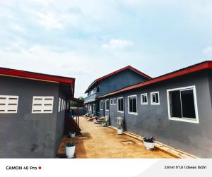 a row of houses sitting next to each other at 0YE' Hotel in Ashalebotwe