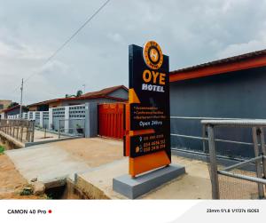a sign in front of a building at 0YE' Hotel in Ashalebotwe