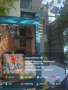 a view of a building with a sign on it at krishna yadav homestay in Hospet