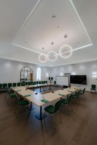a large room with tables and chairs and a screen at Old Ijevan Boutique Hotel in Ijevan +123 photos