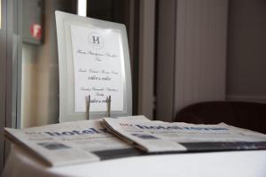 Letto o letti in una camera di Hôtel de l'Ange