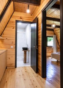an open door in a room with wooden walls at Hatsvali Gate in Mestia